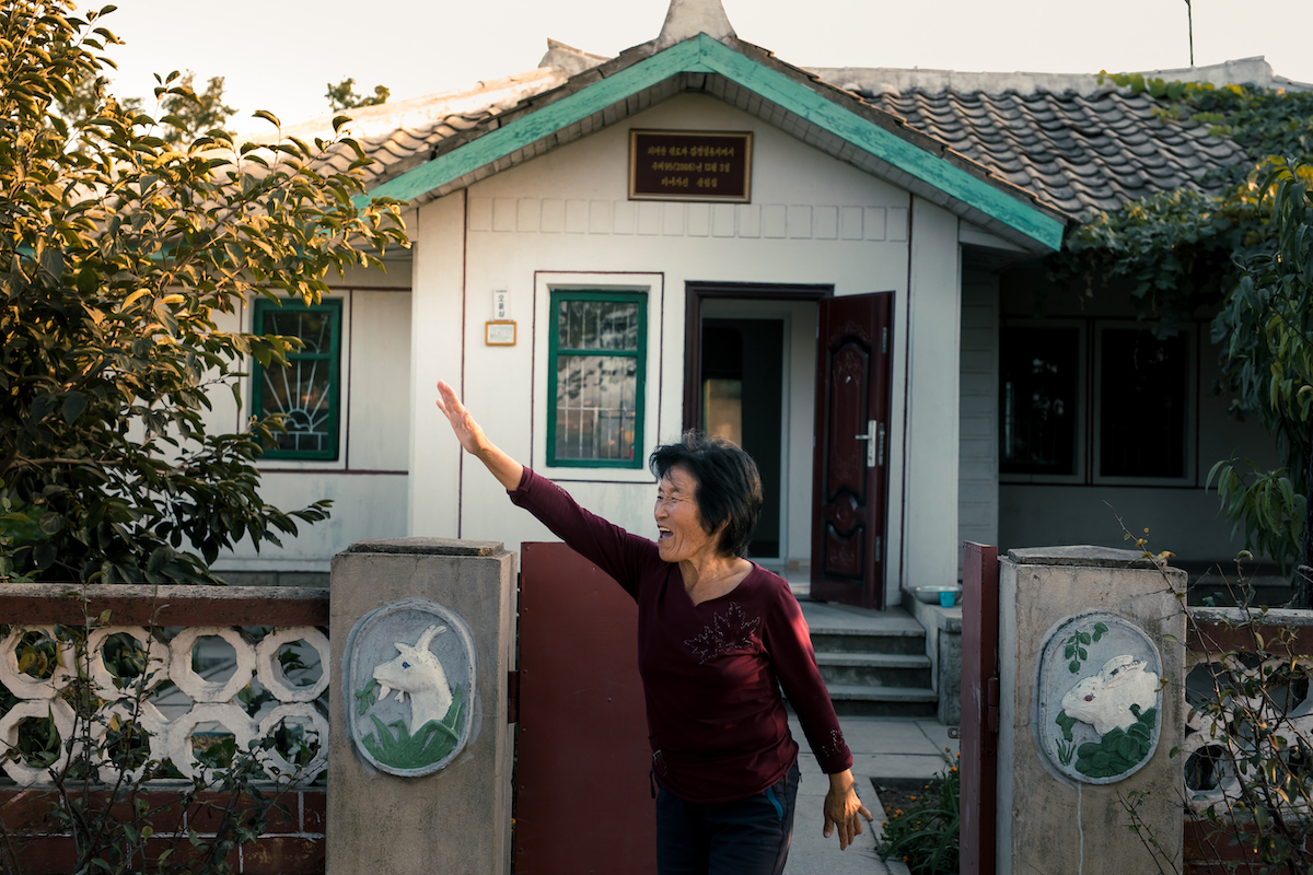 North korean women waving goodbye